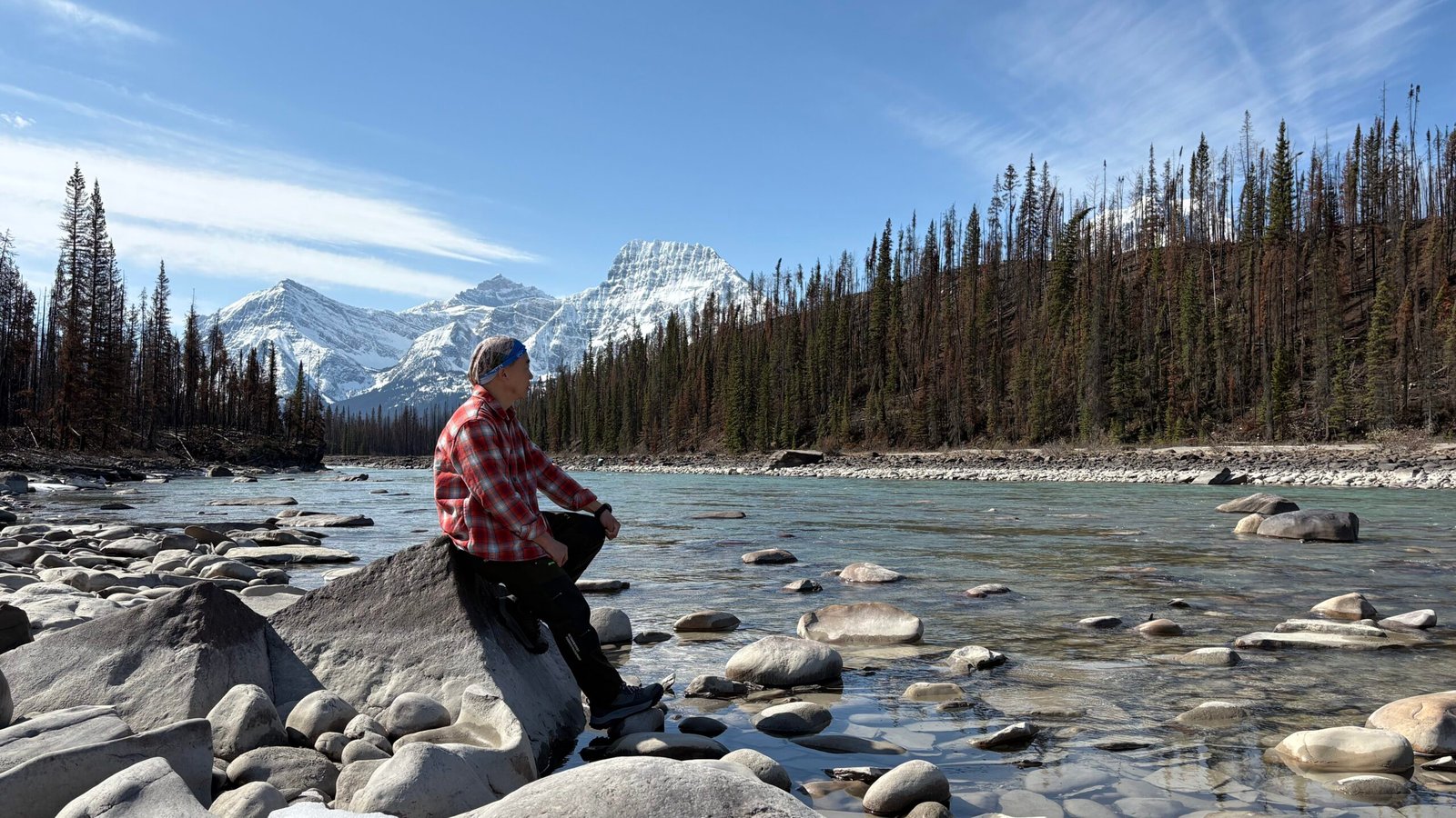 Sustainable Road Trip Guide: Jasper to Banff Icefields Parkway - Breathtaking views unfold along the Athabasca River, where turquoise waters carve through rugged mountain landscapes in Jasper National Park. Part of the iconic Icefields Parkway, this stop offers a perfect moment to appreciate nature’s grandeur while embracing sustainable travel practices. Whether you're capturing the scenery, spotting wildlife, or simply soaking in the serenity, remember to tread lightly—pack out waste, respect wildlife habitats, and support eco-friendly tourism.