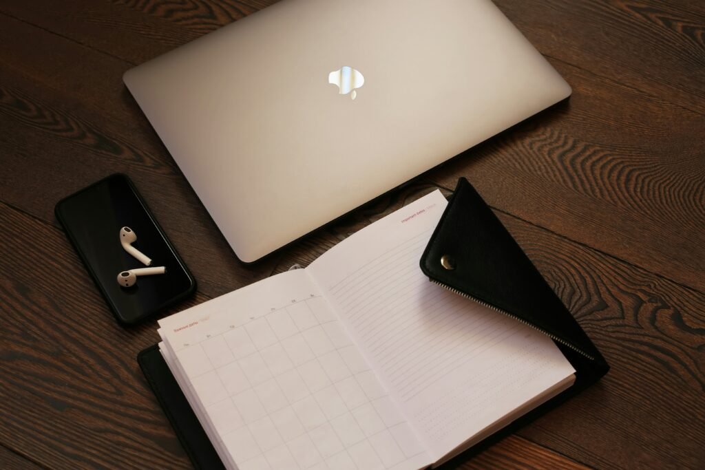 Describe changing in website copywriting with laptop and notebook